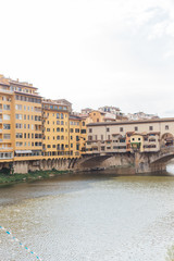 Fototapeta na wymiar view of the Ponte Vecchio bridge on the Arno river in the center of the old city of Florence in Italy