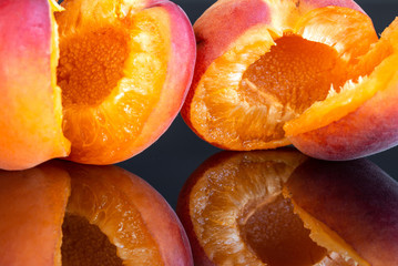 Two Tasty Apricots Isolated On A Black Background 4