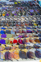 Fototapeta premium Sunglasses of different colors on sale