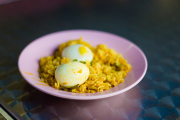 Malaysian boiled eggs on rice
