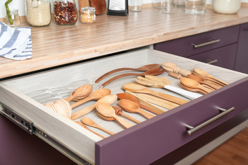 Different utensils in drawer on kitchen