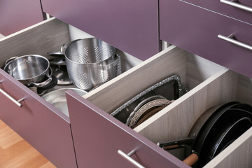 Different kitchenware in drawers