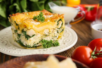 Lasagna with spinach on table