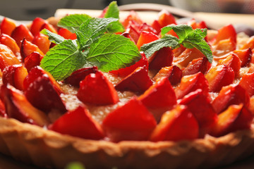 Delicious pie with plums, closeup