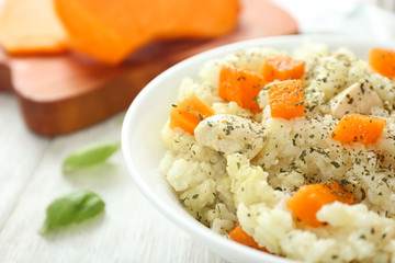 Bowl with delicious pumpkin risotto, closeup