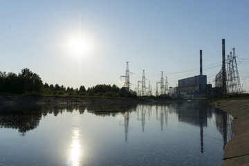 Fototapeta na wymiar Landscape - view of the thermal power station on the side of the cooling channel