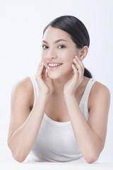 Fototapeta premium beautiful young caucasian woman with dark long hair being half naked, laughing, looking in camera with delight and happy face expression. Beauty and health.