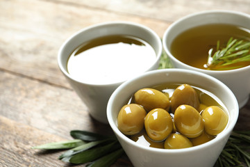 Bowl with ripe olives in oil, closeup