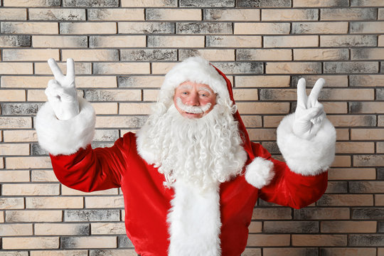 Authentic Santa Claus on brick wall background