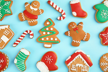 Fototapeta na wymiar Tasty homemade Christmas cookies on color background, top view