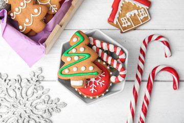 Obraz na płótnie Canvas Bowl with tasty homemade Christmas cookies on table, top view
