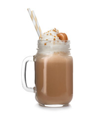 Mason jar with delicious milk shake on white background