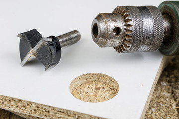 Milling cutter for fixing hinges in chipboard. Joinery accessories for furniture construction.