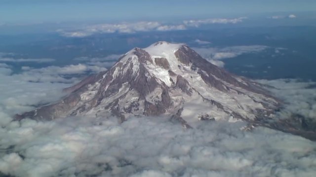 Mt. Rainier Peaks Above Clouds