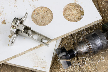 Milling cutter for fixing hinges in chipboard. Joinery accessories for furniture construction.