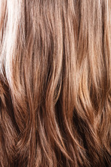 Naklejka premium Natural brown hair closeup background