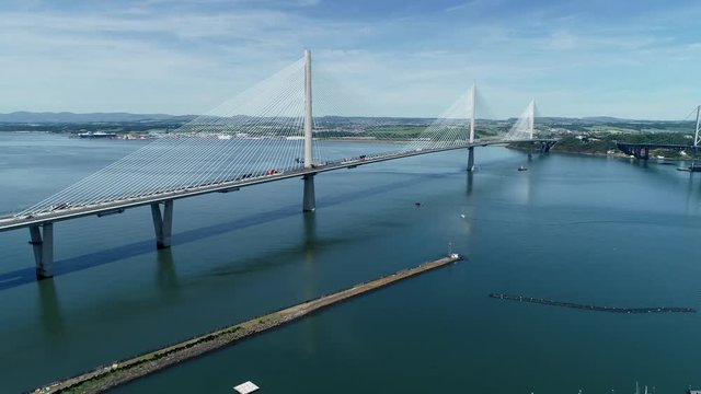 4K aerial footage of the Queensferry Crossing bridge across the Firth of Forth near Edinburgh.