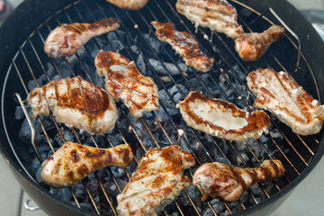 Delicious Grilled Pork and Chicken  Meat  over the Coals on a Barbecue. Picnic Party.
