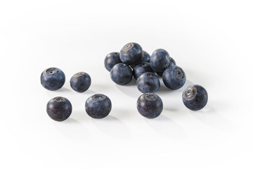 Bunch of ripe blueberries on white background