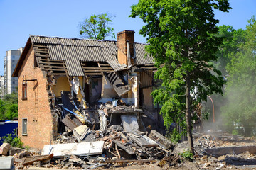 Ruined house damage after disaster. Demolition of old buildings