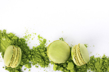Macaroons with green tea powder matcha on white background