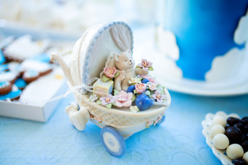 Candy bar decorations on baby's christening party for boy. Decorated in blue and white colors