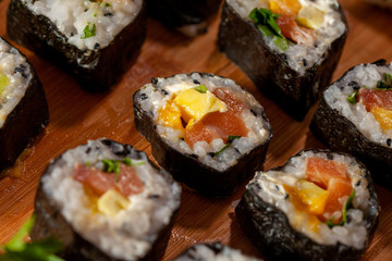 Sushi on a wooden plate