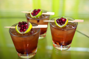 Cocktail Trio in short glass with lime & pomegrante fruit (1719992FBND8RM)
