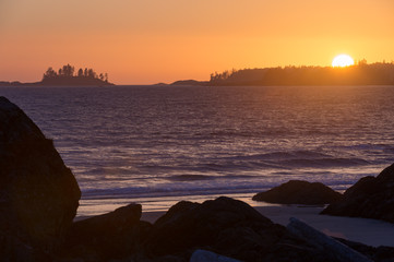 Wild pacific coastline of vancouver island at sunset