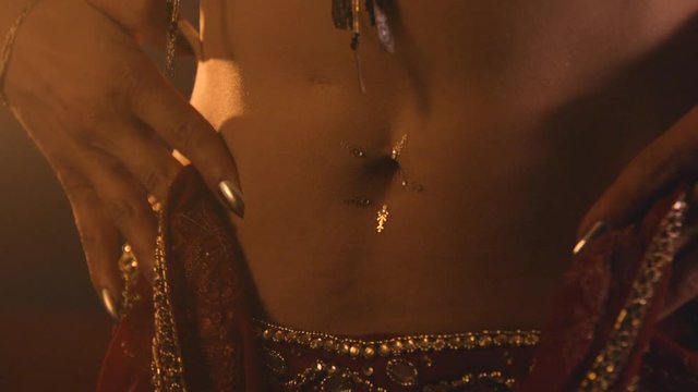 Belly dancer slow motion, warm oriental mood with smoke
