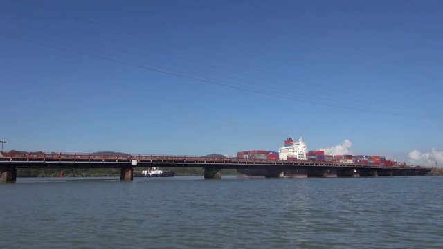 Big Panama Canal Bridge and Ship from a Boat