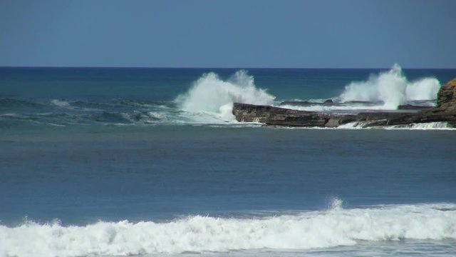 Angry Waves Crashing Against the Rocks
