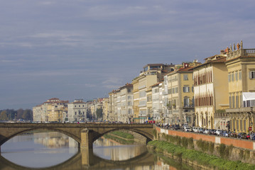 Fototapeta premium Day view of lungarni street in Florence, facing Ponta alla Carraia bridge on Arno river