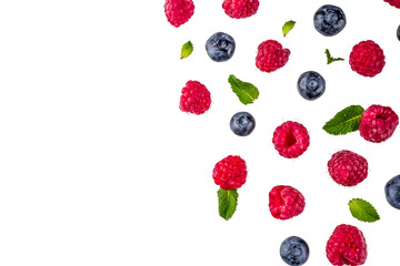 Creative layout with raspberry and blueberry with waffle ice cream cones, simple pattern above copy space