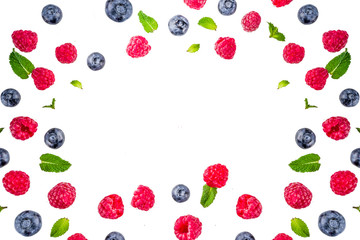 Creative layout with raspberry and blueberry with waffle ice cream cones, simple pattern above copy space