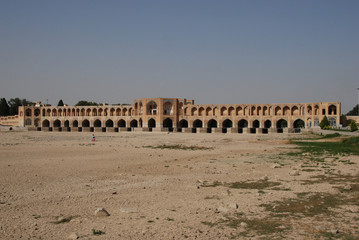 Historic Khaju Bridge in Isfahan fraturing numerous pointed arches