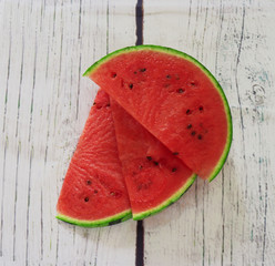 Sliced watermelon slices on a white background