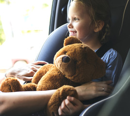 Mother helping to put on the seat belt