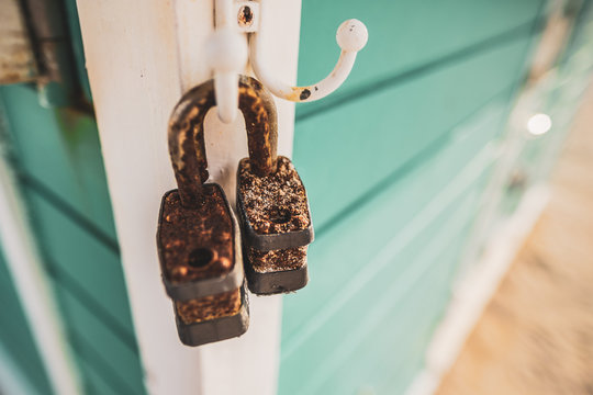 Rusty open lock pads hanging in a beach cabin, Miami Beach