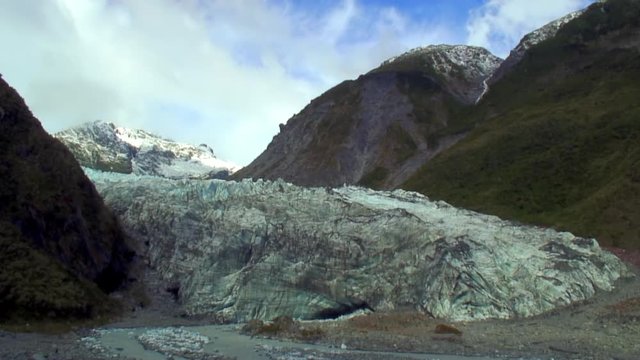 Massive Glacier between Two Black Bluffs 
