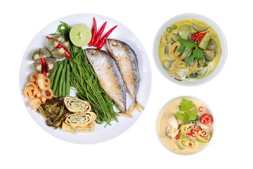 Coconut milk and fermented soy bean sauce and green curry with side dish as deep fired mackarels,omelet,crispy pork rind,halve green lemon,red chili and boiled of eggplant
