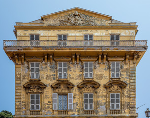 Weathered old building in the Cours Saleya, part of the old town of Nice in France