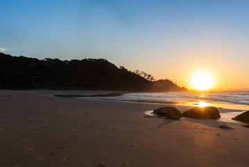 Sunset on the beach with ocean view in Byron Bay, Australia.