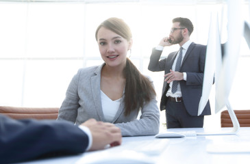 female consultant sitting at her Desk