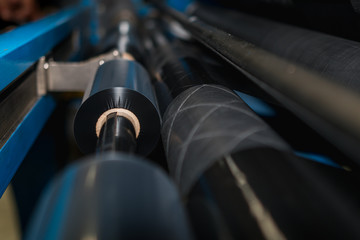 Ribbon slitter in a TTR wharehouse and production factory