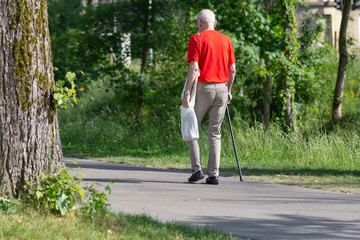senior man with walking stick