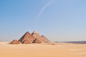 Perfect shot of the Egyptian pyramids under the sun in Giza, Egypt.