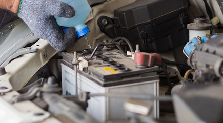 change water car, filling the water, new water into car, pouring fresh water, service car station