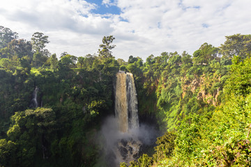 Landscape with a waterfall surrounded by wild forest. Kenya, Africa