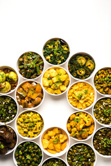 Indian sabzi / vegetable fried recipes served in white bowl over moody or colourful background. selective focus